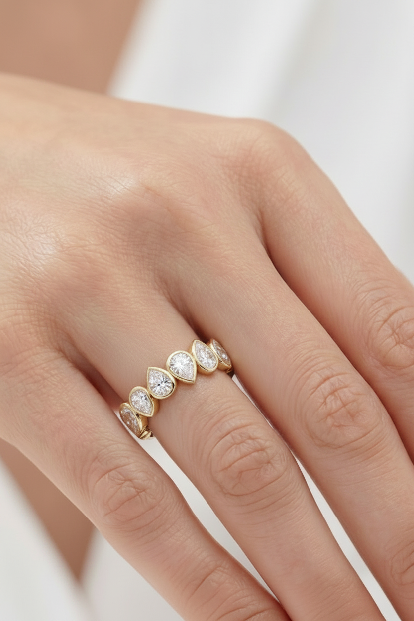 Donna Bezel Set Pear Shaped Inverted Half Eternity Diamond Ring
