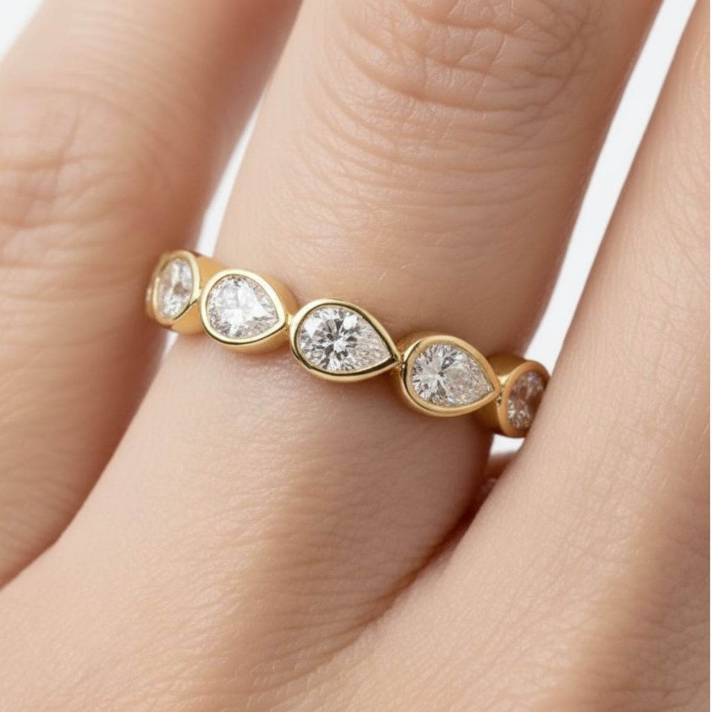 Donna Bezel Set Pear Shaped East West Half Eternity Diamond ring